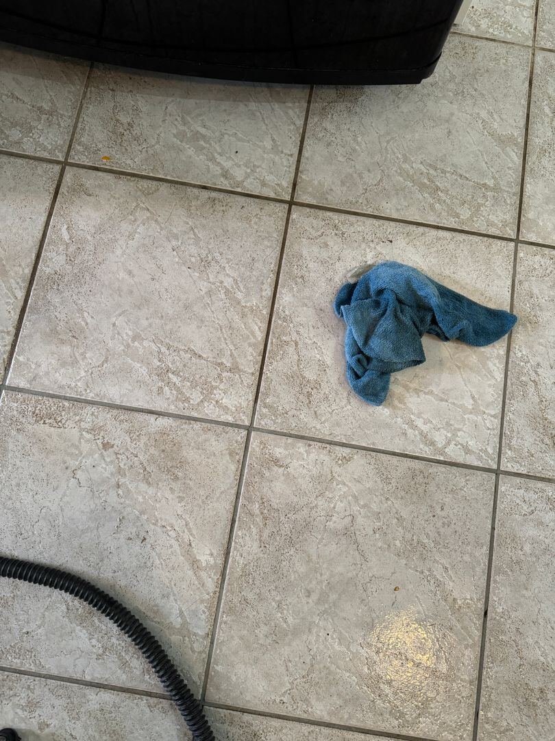 Kitchen floor tile before and after cleaning.