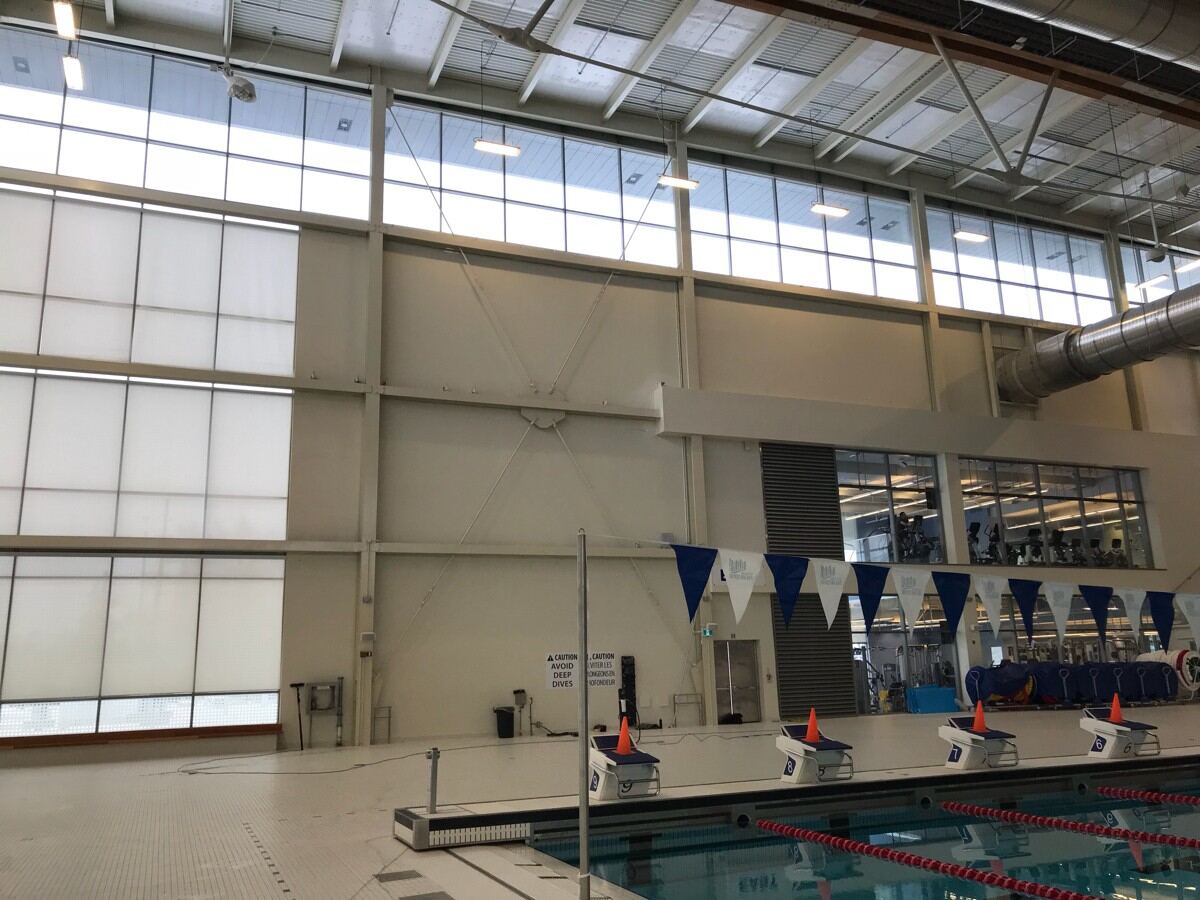Water-fed pole cleaning the Markham Pan Am Centre exterior.