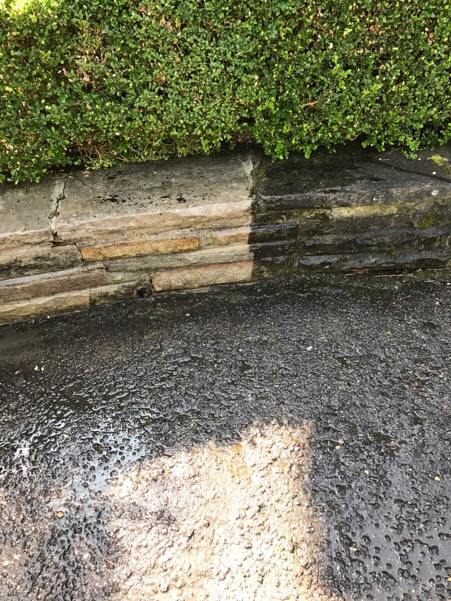 Pressure washed stone wall.